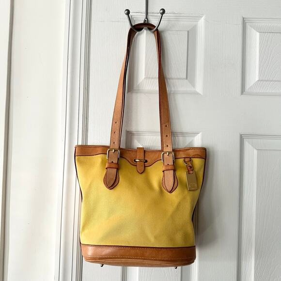 Dooney & Bourke Handbags - Dooney & Bourke Cabriolet Yellow Canvas Leather Trim Bucket Buckle Shoulder Bag